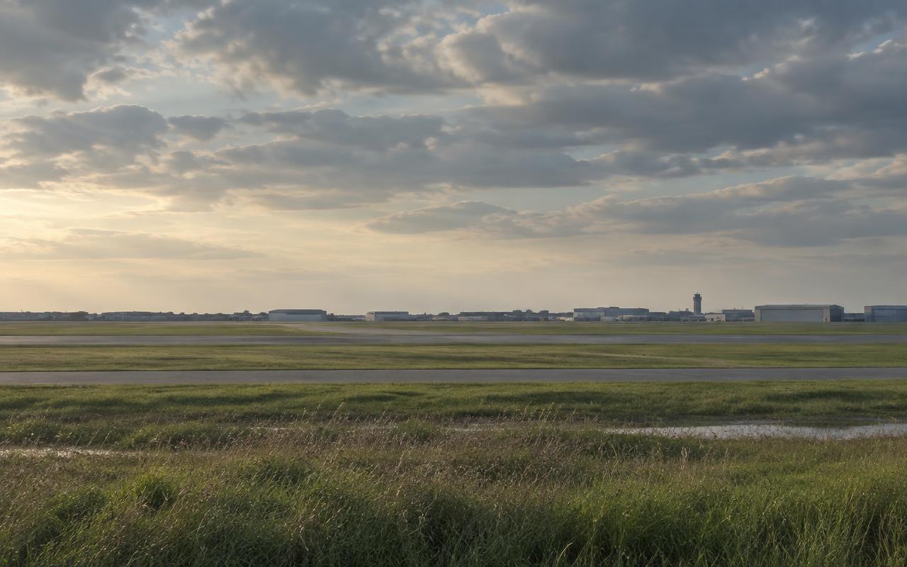 Atmospheric view across an open Long Island airfield landscape